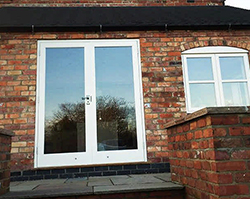 Double doors leaving into a house extension.